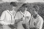 Chapman College baseball coach Don Perkins and two team members