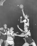 Chapman College basketball team during game, ca. 1958