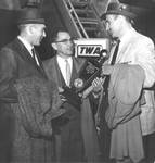 Bob Hamblin, Chapman President Davis, and Don Perkins with basketball trophy, 1960