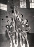 Ned Eckert, Tom Cooke and LeRoy Stevens posing in gym, Chapman College, Orange, California
