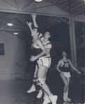 Basketball game in "The Box" [gym], Chapman College, Orange, California. The gym was constructed in 1926 and torn down in 1976.