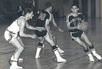 Doug Eckert [14] with basketball during game, 1968-1969 season