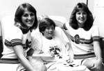CHOC patient Michelle Nicks with Chapman College cheerleaders Lynda Schmoll and Julie Zlet