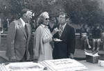 Davis L. Chamberlin, Betty Hutton, and George Argyros with cake for the Hutton Sports Center groundbreaking, March 22, 1977