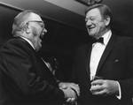 John Wayne greets Andy Devine at the reception prior to the Chapman College Challenge '70 Dinner