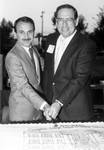 Dr. James Doti and George Argyros cut the Chapman College Annual Economic Forecast cake