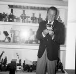Louis Hayward holding a Cine-3mm camera in the Berndt Museum