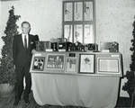 Eric Berndt by a portion of his historical camera display, SMPTE conference, 1968