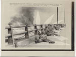 Soldiers Take Cover on Bridge